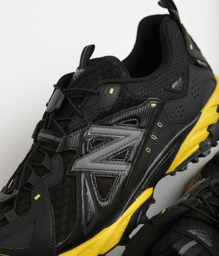 Black and yellow new balance shoes hotsell