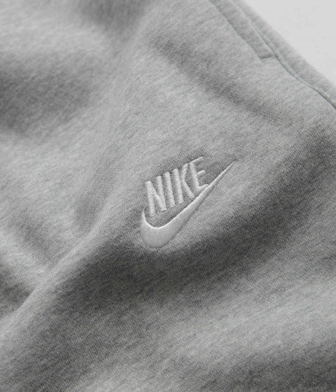 Nike Club Fleece Joggers in Dark Grey Heather and Matte Silver / White