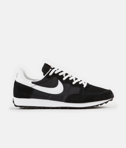 Nike white sneakers with black tick hotsell